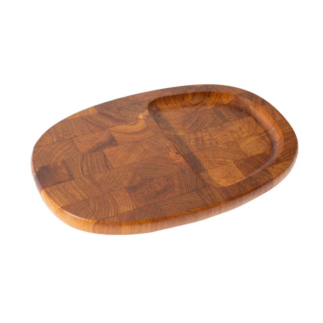 An oval cheese board designed by the Danish designer Jens Quistgaard (1919-2008) for Dansk International Designs. Made of...