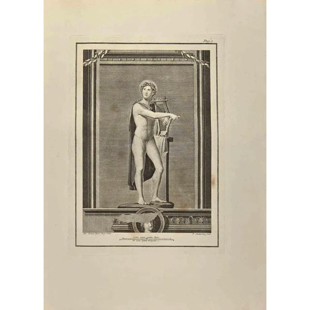 Apollo God with his Lyre from "Antiquities of Herculaneum" is an etching on paper realized by Pietro Campana in the 18th...