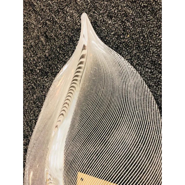 Amazing pair of murano glass leaf sconces with a zebra stripe pattern, 1970's. Each measures roughly 17" by 10" wide, and...