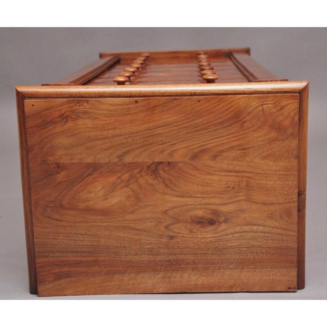 Early 19th Century antique Regency walnut Wellington chest, having a nice figured top sitting above a shaped cornice, the...