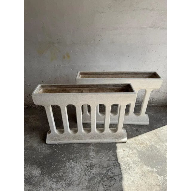 Pair of Sculptural Mid-Century Concrete Planters – Brutalist Style Striking and architectural, this pair of vintage...