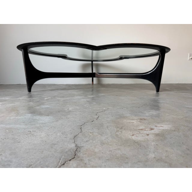 An unusual cloverleaf shaped Mid Century Modern style coffee table by Lane, their Silhouette Series. This beautiful coffee...