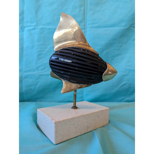 Frederick Cooper Mid-Century Modern Fish Sculpture. Brilliant use of materials consisting of brass and stone. Measures 10”...
