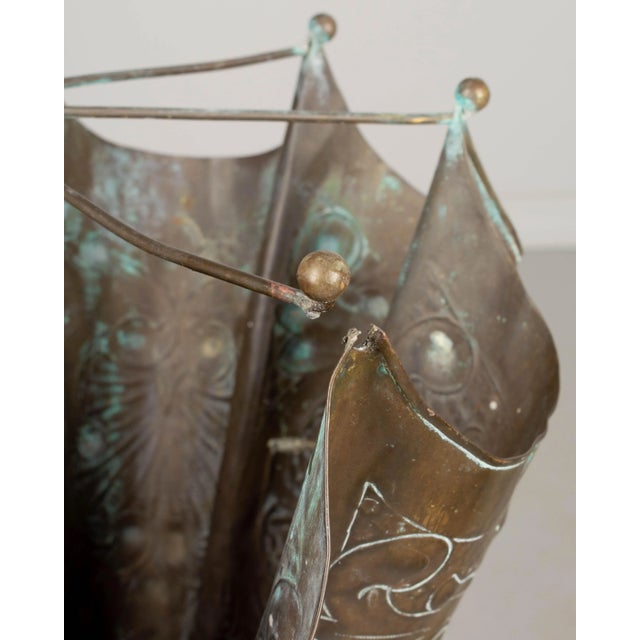 A French embossed brass umbrella stand with nice verdigris patina. Minor dents. Circa 1900. 40"H x 18" Diameter