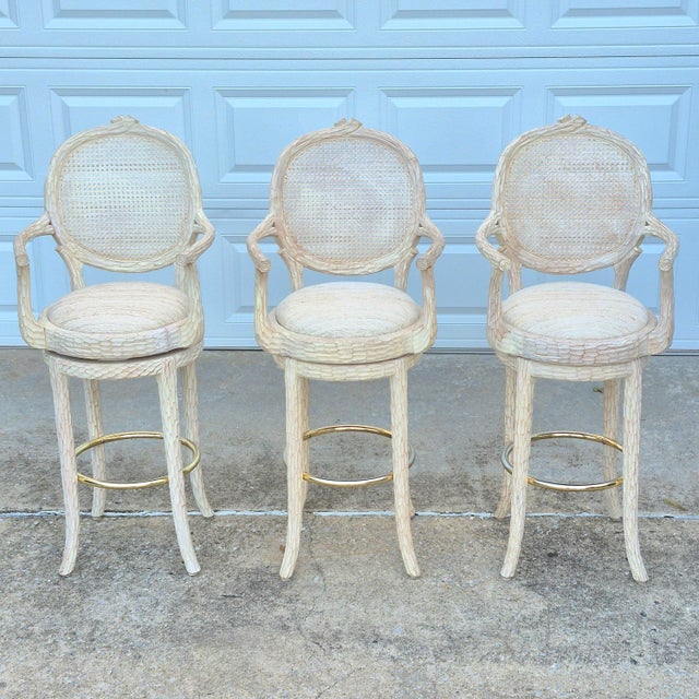 This is a fabulous set of 3 vintage faux bois swivel bar stools with a 29.5" seat height. The stools are unbranded, but...