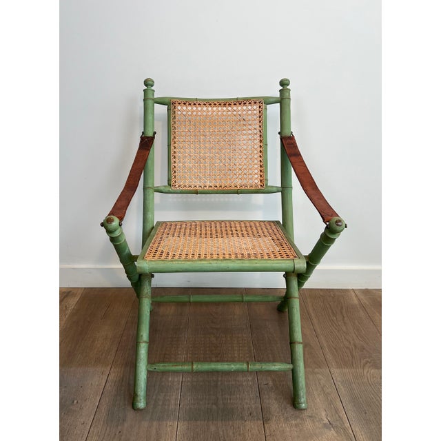 Green Pair of 1970s folding safari chairs in weathered faux bamboo with caned backs and seats For Sale - Image 8 of 12