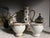 The service is made in the Empire style, has rich gilding on all items, hand-painted by the artist-decorator M. Carpezat,...