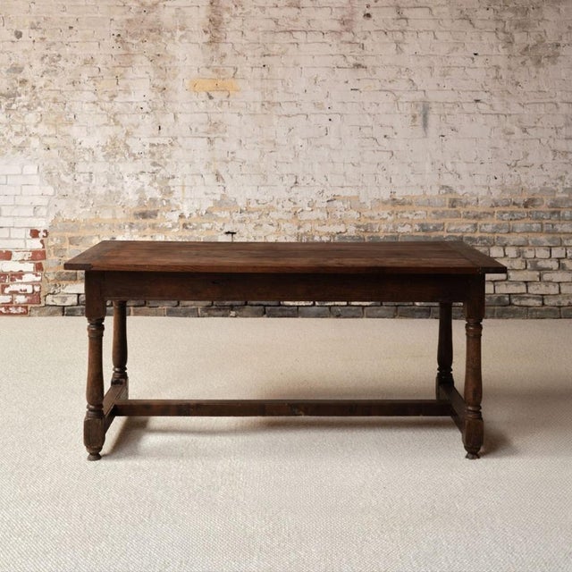 Add timeless French character to your space with this 19th century French wooden table, a beautifully crafted piece that...