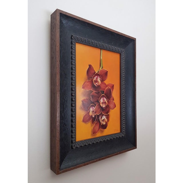 This artwork features a vibrant arrangement of Cymbidium orchids, their rich maroon petals contrasting beautifully against...