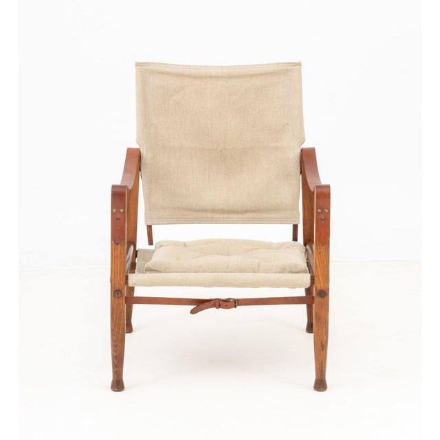 Kaare Klint (Danish, 1888-1954) Model KK47000, Safari Lounge Chair, ash wood frame with tan leather straps and canvas seat...