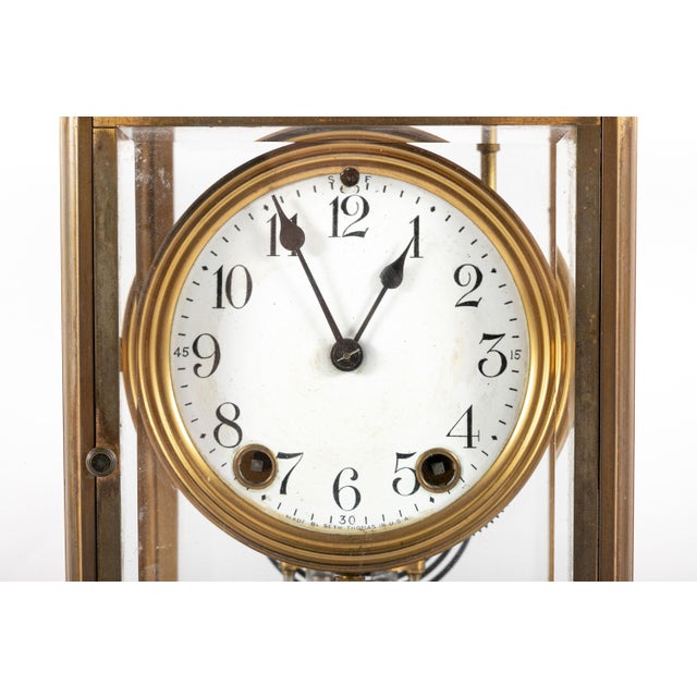Early 20th century brass and glass crystal regulator or carriage clock with beveled four-sided glass panels, white enamel...