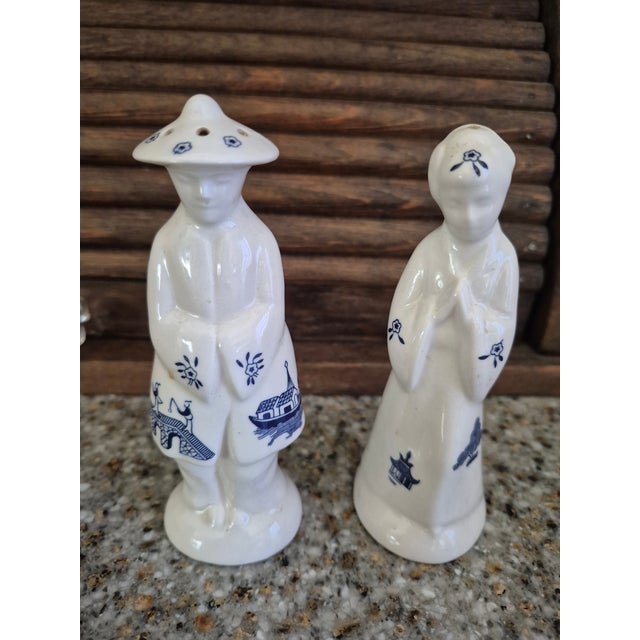These are Churchill China of England Blue Willow figural salt and pepper shakers0 .Design: The set features a man and...