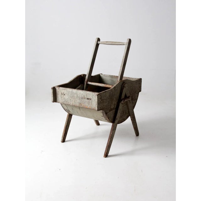 This is an antique laundry wash tub with a rocking agitator, circa mid to late 1800s. The wooden wash stand features a...