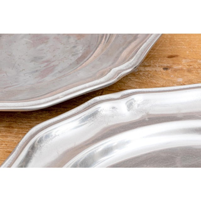 Classic Wilton Ware pewter chargers of traditional form. A set of 10, as shown in images.