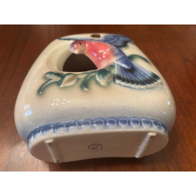 This is an adorable mid-century modern vase or planter by Royal Copley. The vase features a blue bird in flight and an...