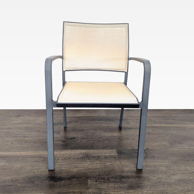 These chairs features a sturdy metal frame with sleek armrests and a comfortable beige mesh seats and backs. Their modern...