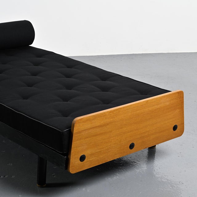 The scal daybed by jean prouvé. This is charlotte perriand's version with a swiveling writing surface. black lacquered...