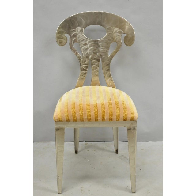 Vintage Postmodern Regency Style Brushed Steel Spade Back Dining Chairs - Set of 4. Circa Late 20th Century. Measurements:...