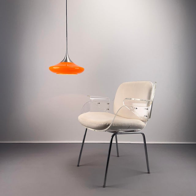 Elegant orange Tulip pendant lamp from the Fürth-based lighting manufacturer Doria. Hand-blown glass shade with polished...