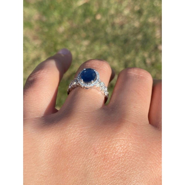 The Credenza: Natural Sapphire and Diamond Ring in White Gold. At its heart lies a stunning 2.00 carat oval brilliant cut...