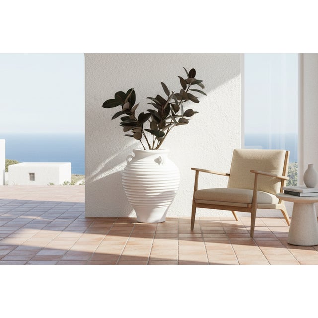 This impressive vessel is a contemporary reimagining of the ancient Greek Amphora or storage jar. Standing nearly 2.5 feet...