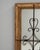 A 1900s French wood patinated mirror distinguished by its striking combination of rustic texture and wrought iron...