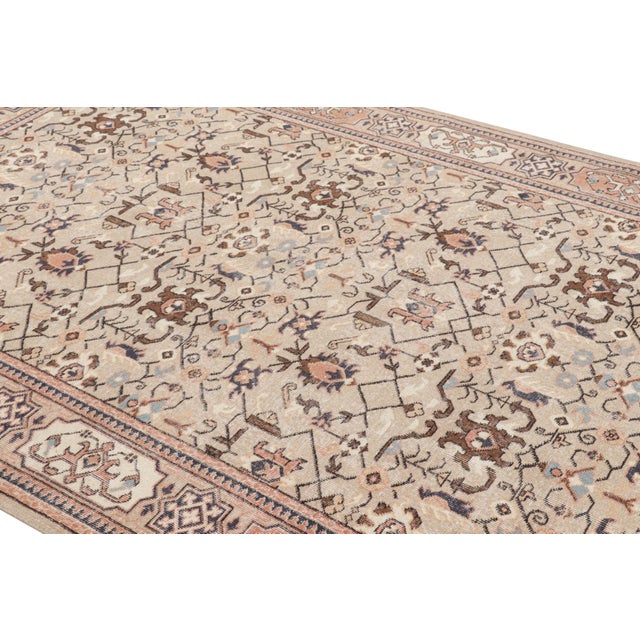 Hand-knotted in wool, this 7x10 vintage rug originating from Turkey, circa 1950-1960, is a very special piece, featuring a...