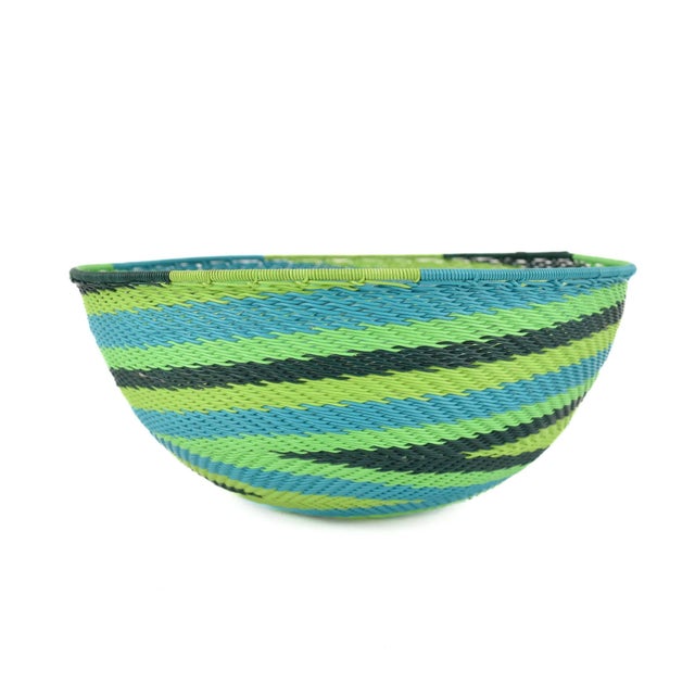 Zulu Telephone Wire Baskets from South Africa epitomize the fusion of traditional craftsmanship and contemporary...