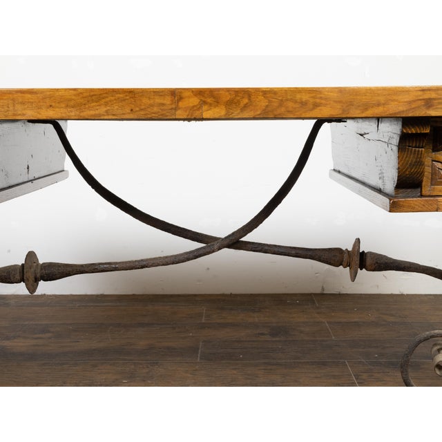 An Italian Baroque style walnut desk table from the late 19th century, with inlaid top, two drawers, lyre-shaped legs and...