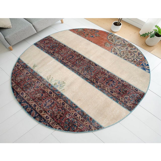 This contemporary Anatolian round patchwork rug is a masterful composition of history and modern design, meticulously...