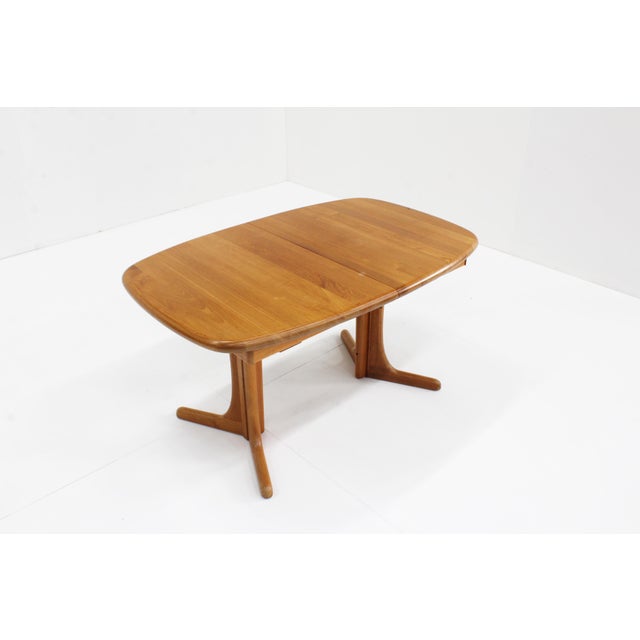 Vintage Danish oval extendable dining table made of solid teak wood from the 1960s in Denmark. Thanks to the handy...