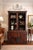 Striking monumental Spanish Colonial cabinet in richly toned rustic wood with dramatic wrought iron grille doors,...