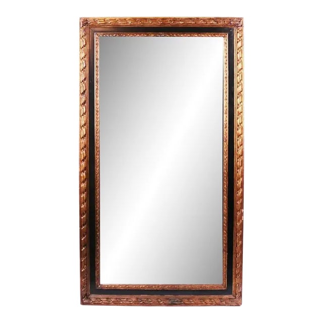 20th Century Parcel Giltwood and Ebonized Mirror For Sale