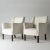 Pair of elegant lounge chairs by Einar Larsen. Contemporary look, upholstered with white bouclé fabric. Seat height 42 cm....