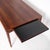 Stunning Scandinavian rosewood coffee table from the 1960s-1970s. Featuring a black laminate-covered extension leaf, this...