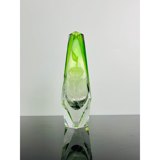 An exceptional signed Moser Karlsbad art glass vase crafted from green uranium glass with a clear crystal base. The...