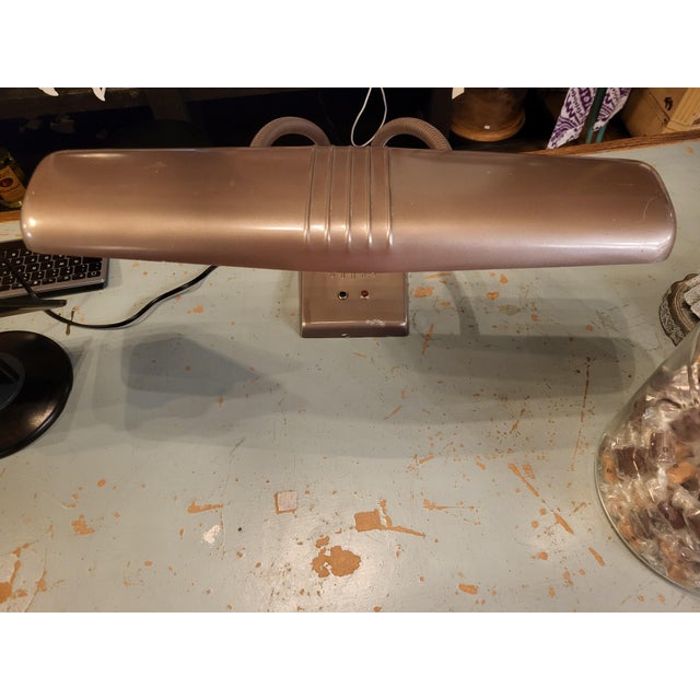 Sleek art deco-style vintage fluorescent desk lamp. Made of steel with a warm coppery bronze finish. The stylish double...