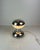 Beautiful table lamp shaped like a diabolo, made of shiny chrome and white opaline glass. Iconic piece of the Space-Age...