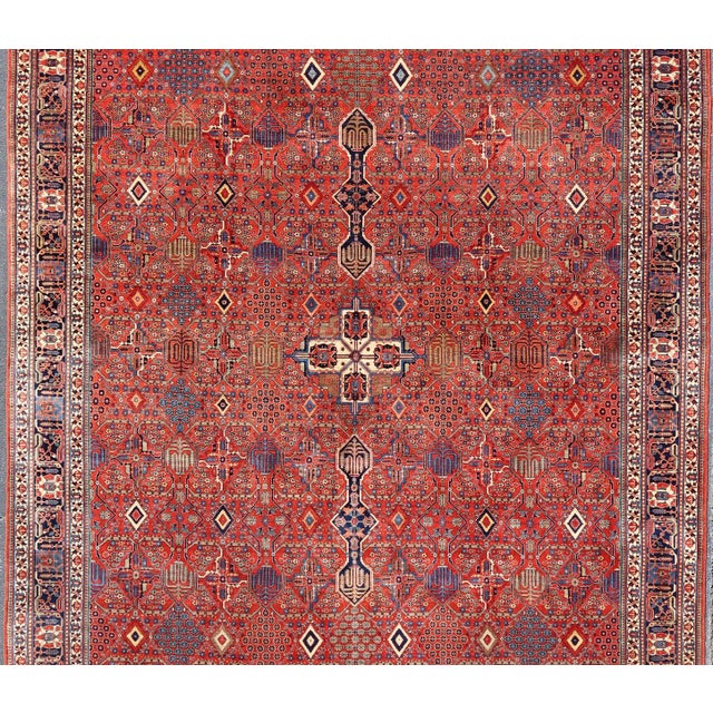 Measures: 12'0 x 16'5 Antique Joshegan Rug With Rich Red Field, Geometric Motifs and Navy Borders 12 X 16'5. Keivan Woven...