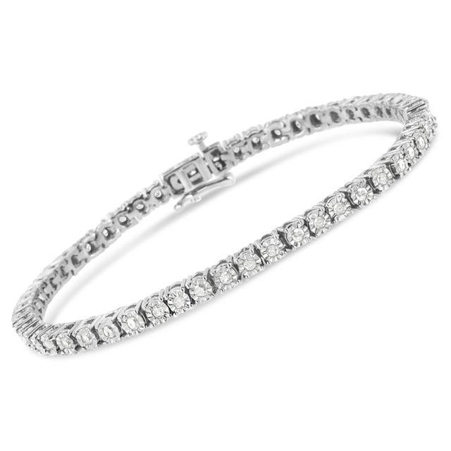 Fifty four, miracle set, promo quality, rose cut diamonds twinkle in this classic tennis bracelet. Crafted in polished...