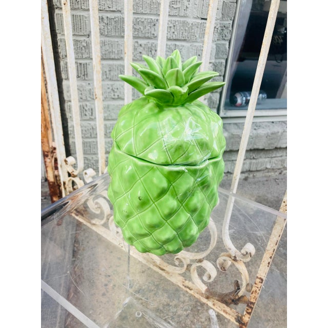 Stunning color and beautiful design, this classic pineapple by Mottehedeh will be a statement for any room. The top lifts...