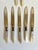 Dating to the late 19th century, this charming collection of seven antique table knives and spreaders features beautifully...