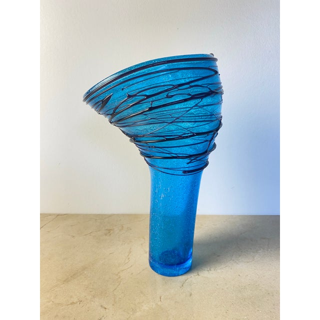 Hand-blown Murano art glass vase bearing the Simone Cenedese Murano label, in a vivid cerulean-blue glass with a lightly...