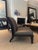 Set of four Holly Hunt H studio armless chairs. Upholstered in gray leather with wood ebony frame. Good condition with...