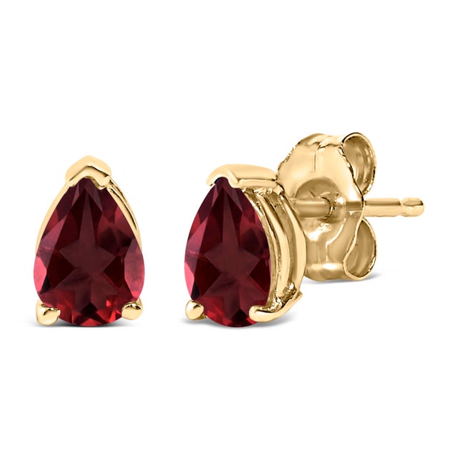 Envision the allure of glimmering garnet isles each time you adorn these exquisite solitaire stud earrings, featuring...