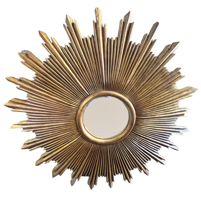 Starburst Mirror by Carol Canner for Carvers’ Guild. A striking mirror interpretation of the classic sunburst form....