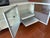 Frosted tempered glass doors and glass shelves in aluminum frames with steel base and finished cut outs in the back for...
