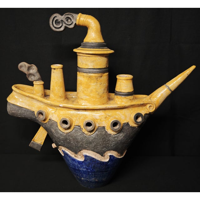 A rare raku ceramic sculpture by artist Lucio Liguori (Raito), depicting a steamship, a work with a strong visual and...