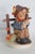 This adorable Figurine is made of porcelain ceramic. This charming Hummel figurine is titled "She Loves Me, She Loves Me...