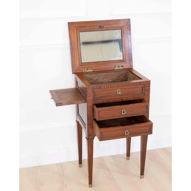 Made in France in the nineteenth century, this Louis XVI style side or bedside table is constructed in wood veneer. The...